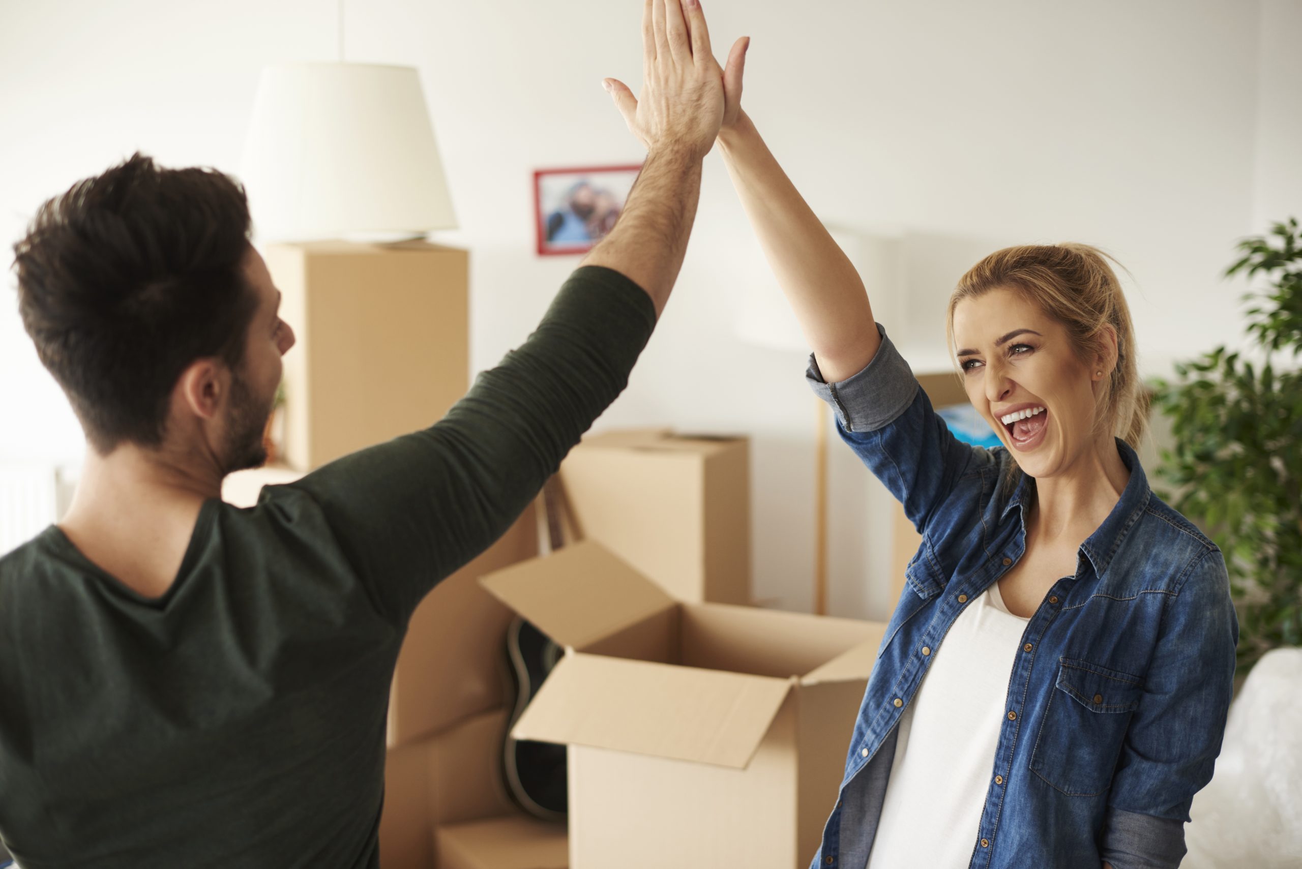 New home buyers celebrate a negotiation