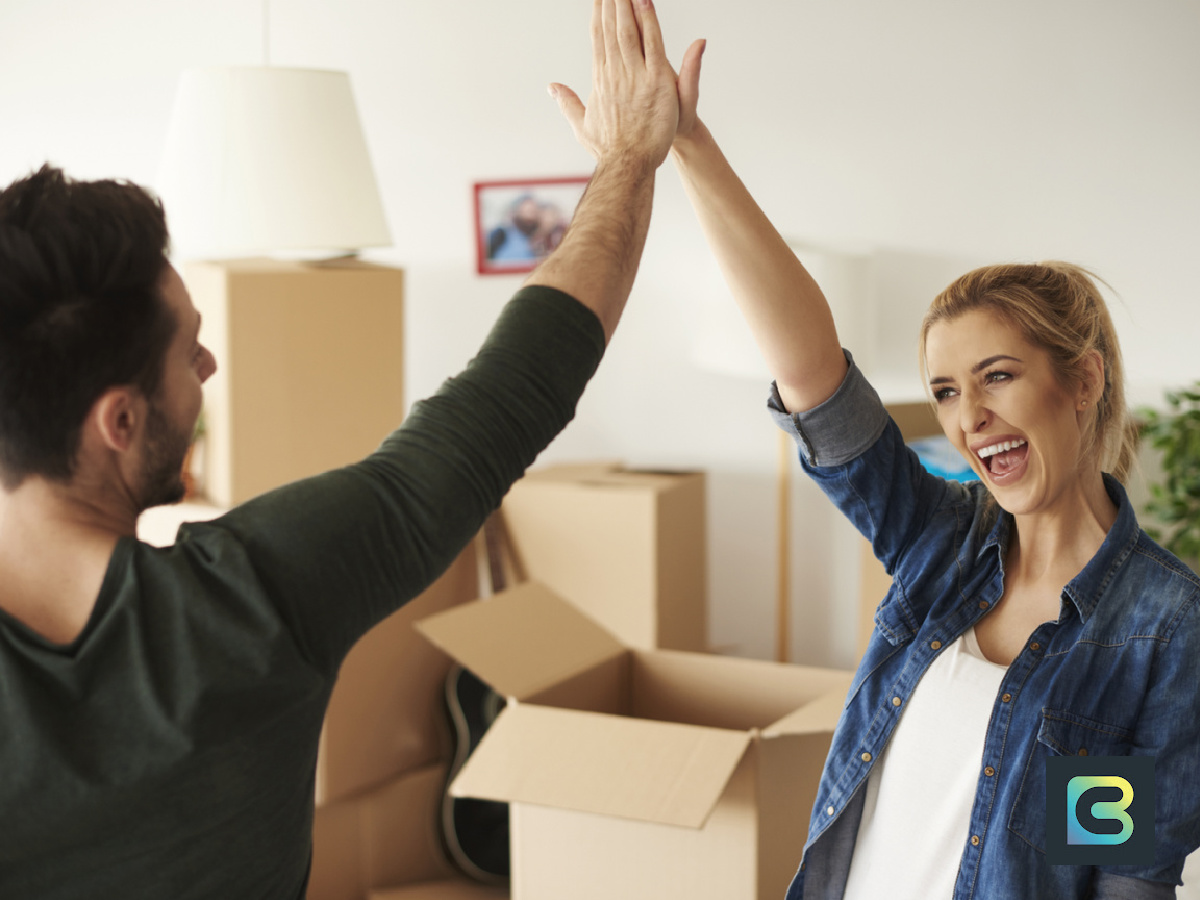 Couple celebrating a home purchase.